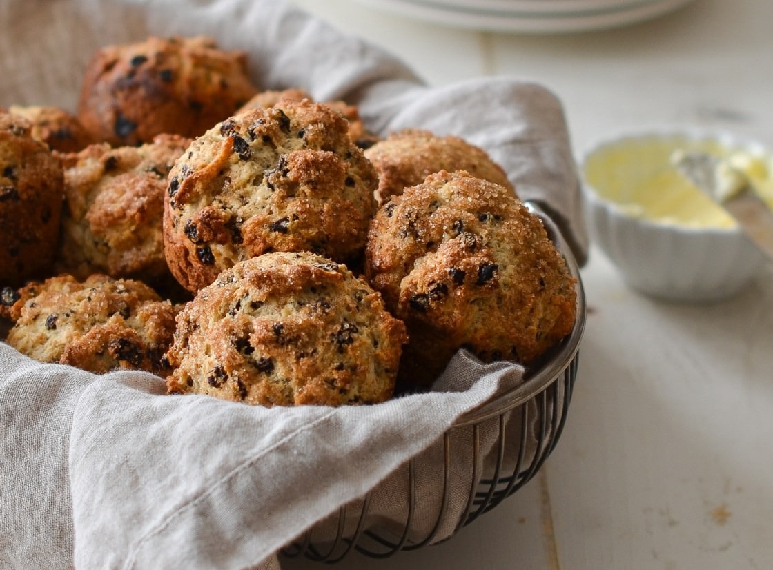 Bunch of muffins with currant on a wire basket. 