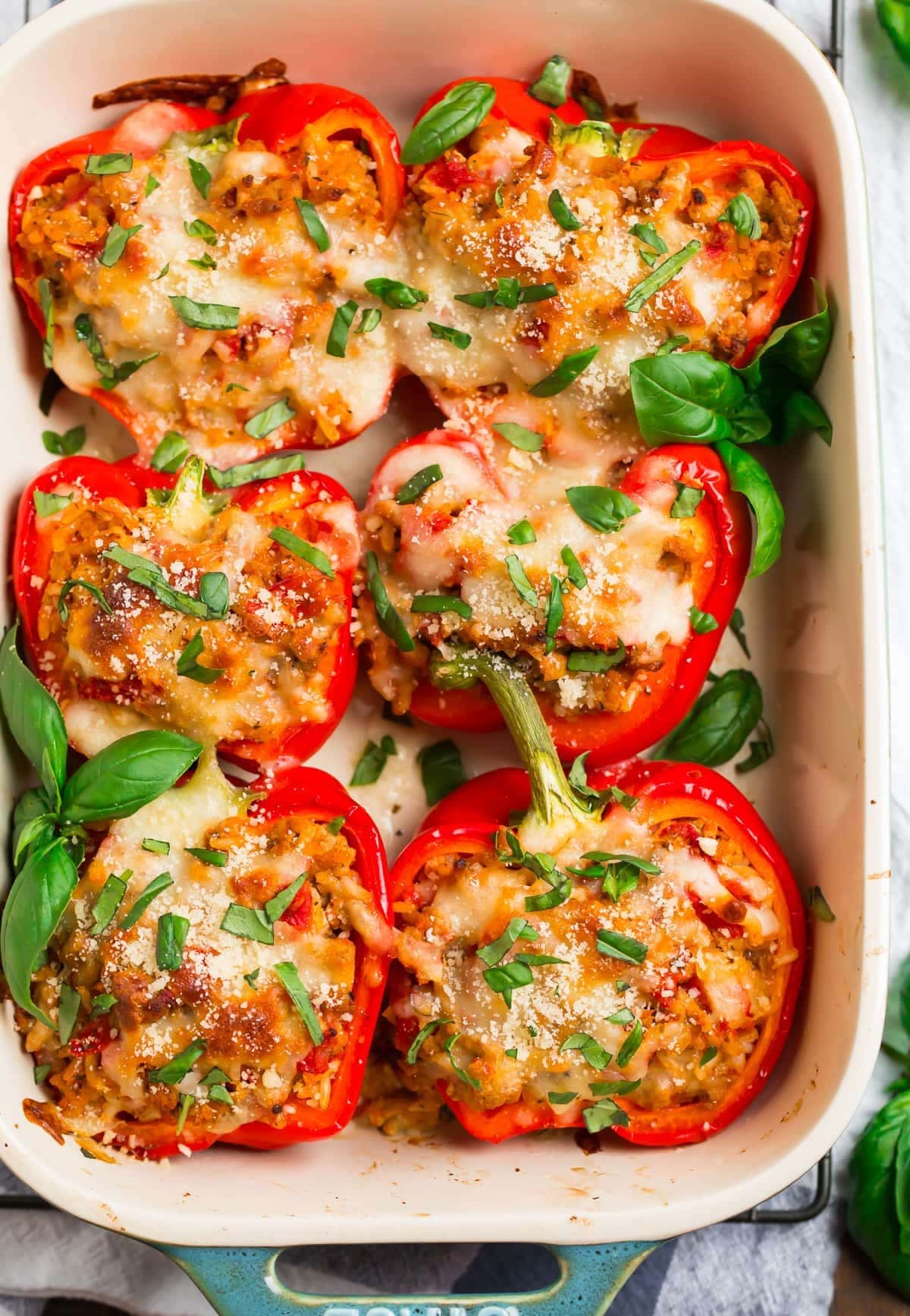 Peppers stuffed with herbed chicken, topped with cheese. 