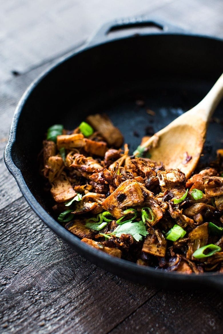 Seasoned jackfruit carnitas on a skillet.