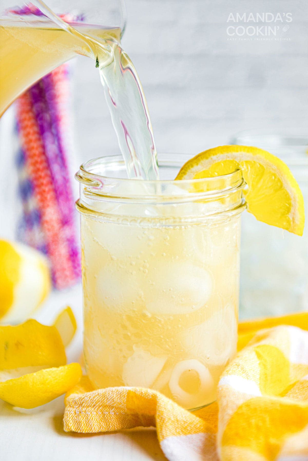 Cold Lynchburg lemonade with lemons and ice in a glass