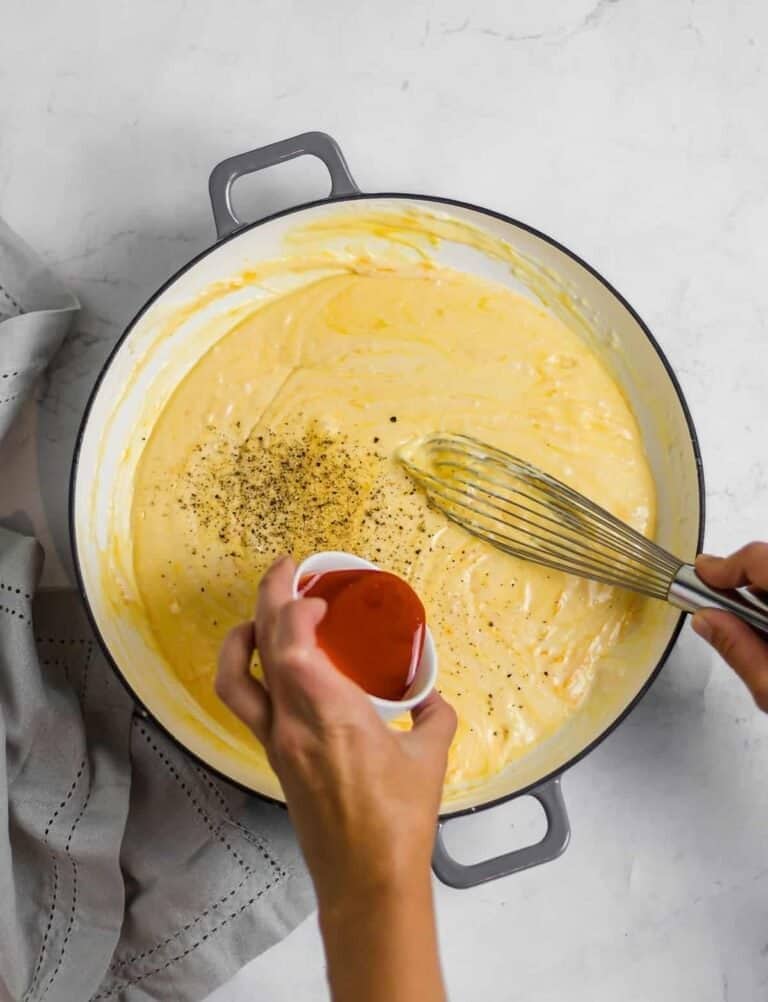 Mac and cheese sauce mixed on a pot. 