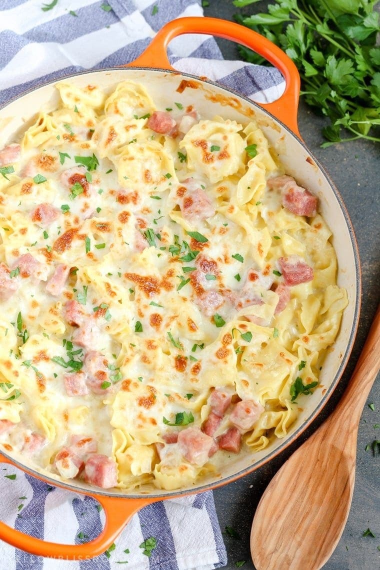 Ham and cheese tortellini cooked in a pan.