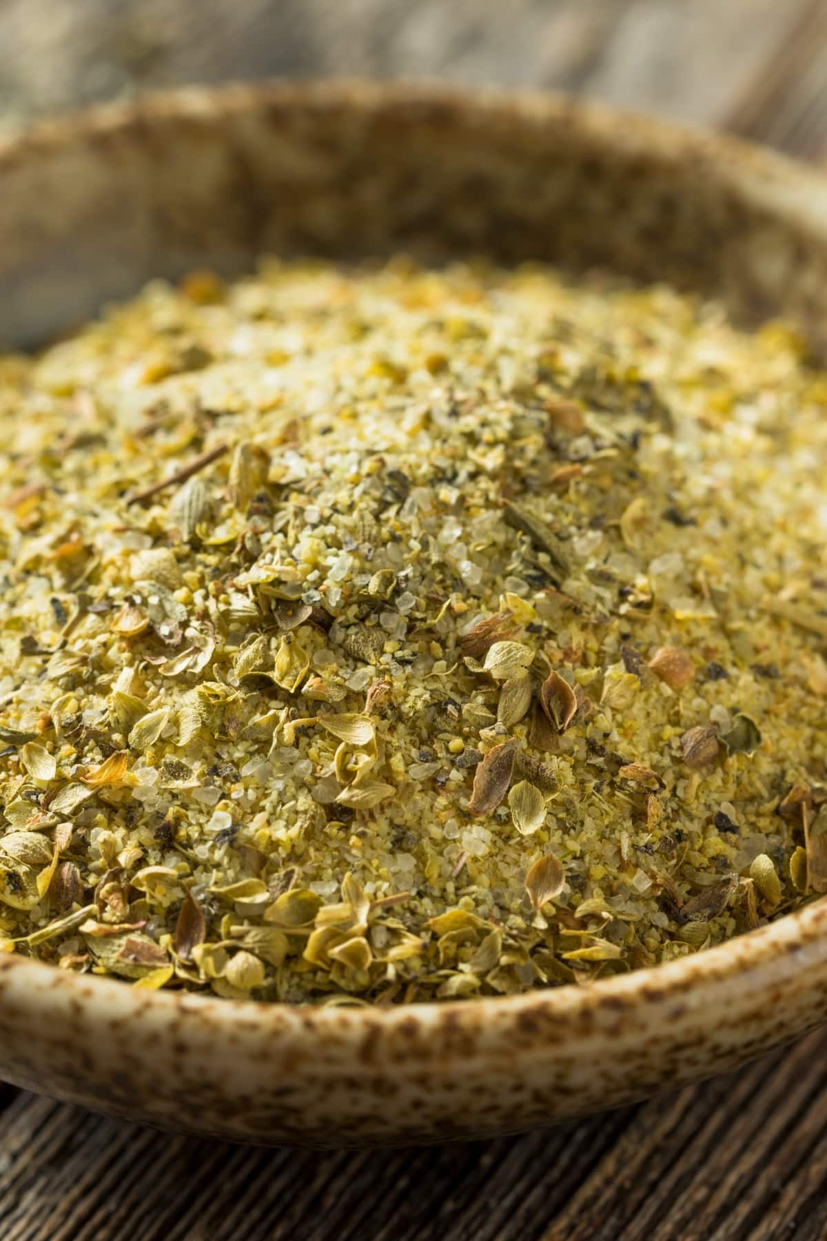 A Bowl Filled with Adobo Seasoning on a Wooden Board