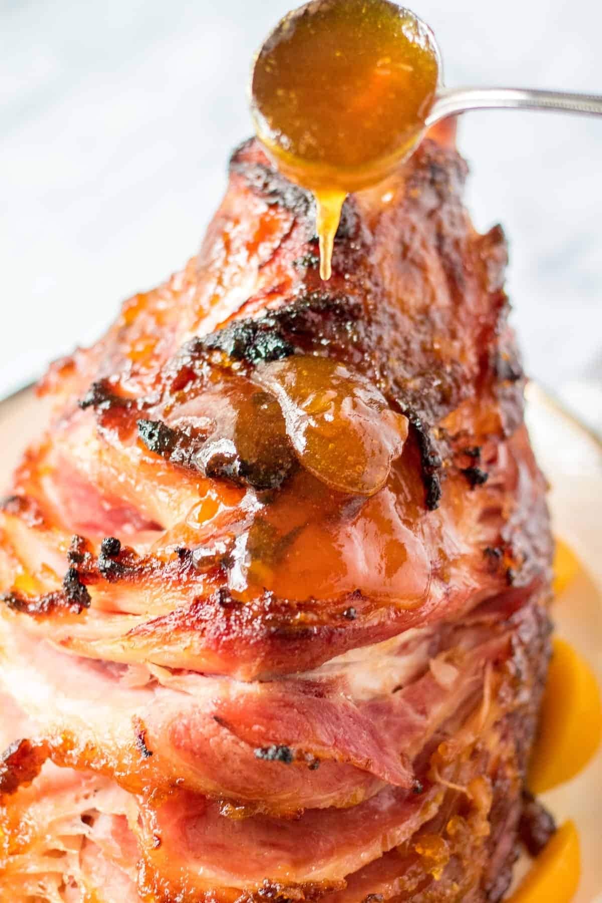 Spiral ham with dripping pear glaze sauce. 