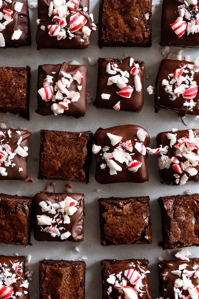 Brownie bars topped with chocolate syrup and crushed candy cane.