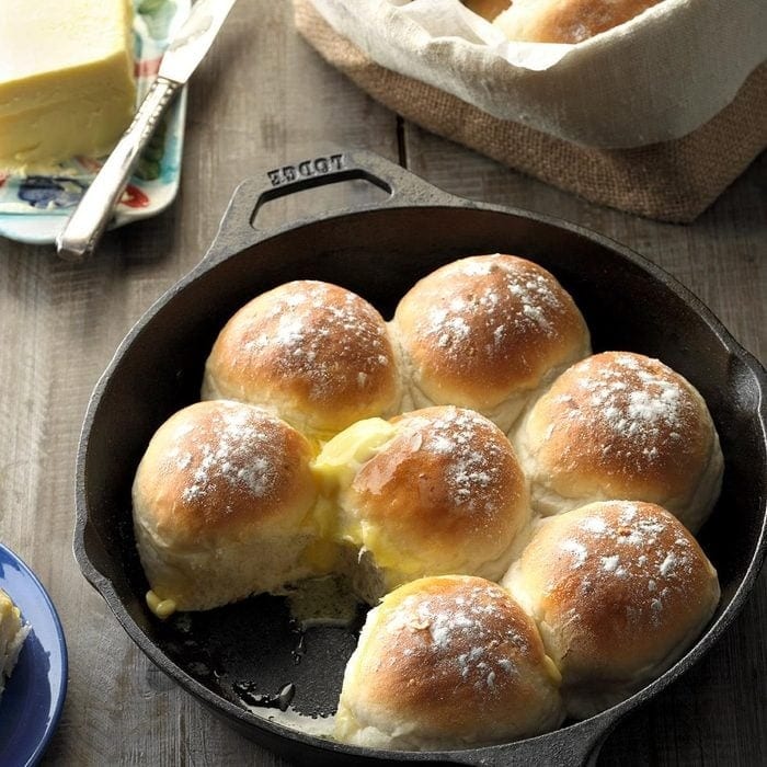 Bread rolls in a cast iron with butter