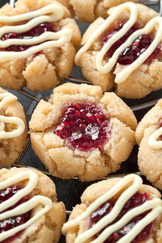 Thumbprint cookies with raspberry in the middle drizzled with white chocolate. 