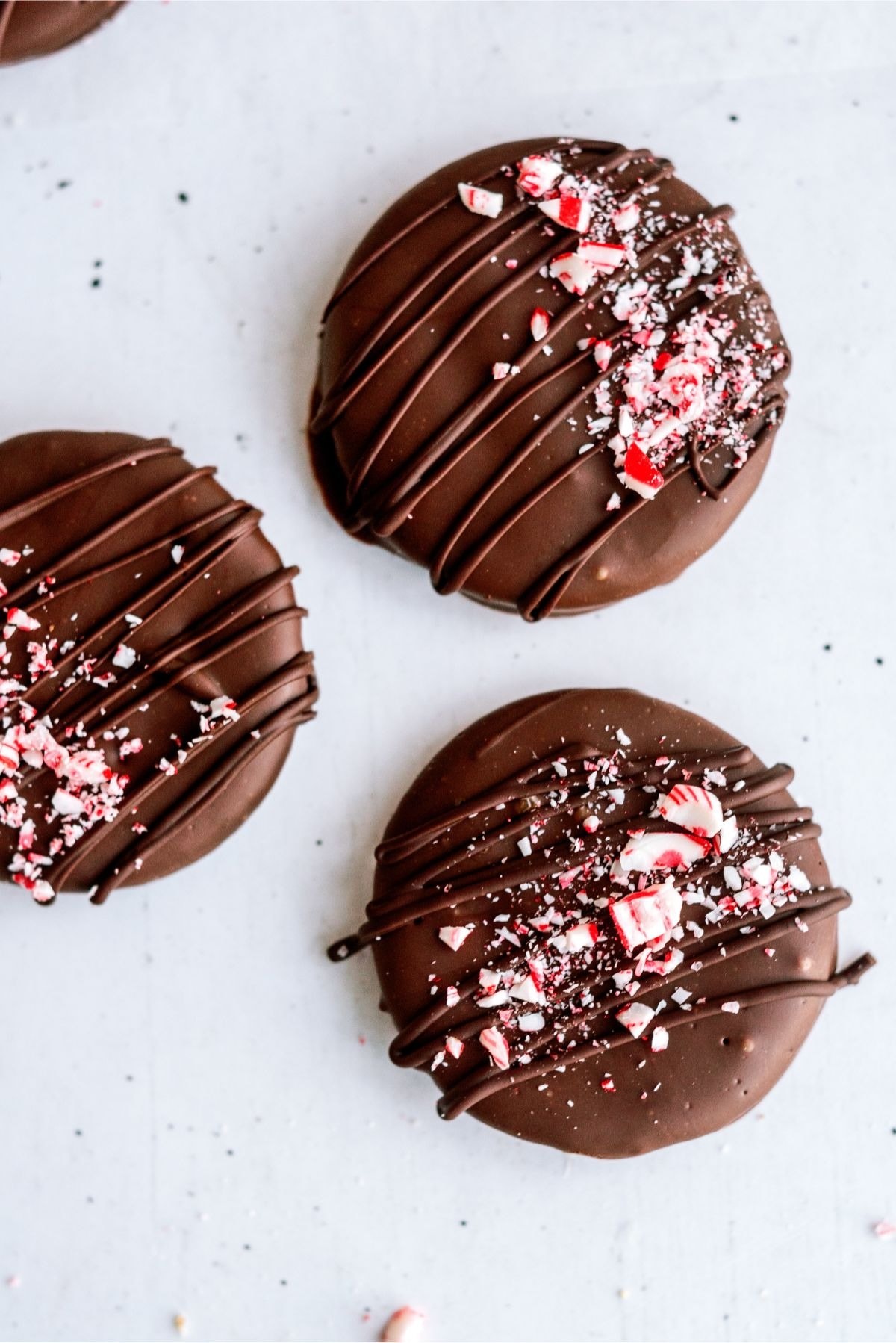 Chocolate covered crackers drizzled chocolate syrup and garnished with crushed peppermint candies. 