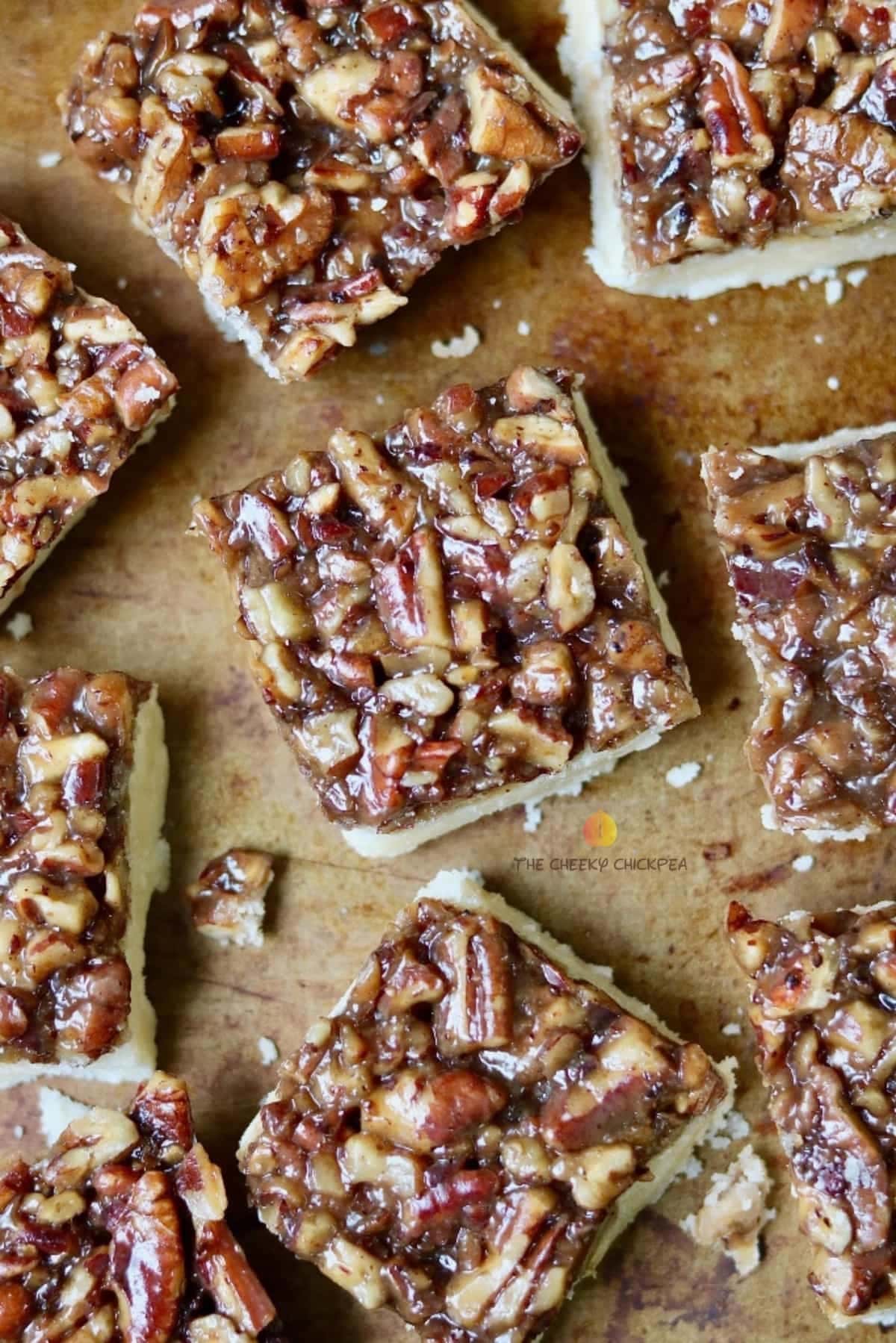 Shortbread bars topped with pecan and caramel syrup. 