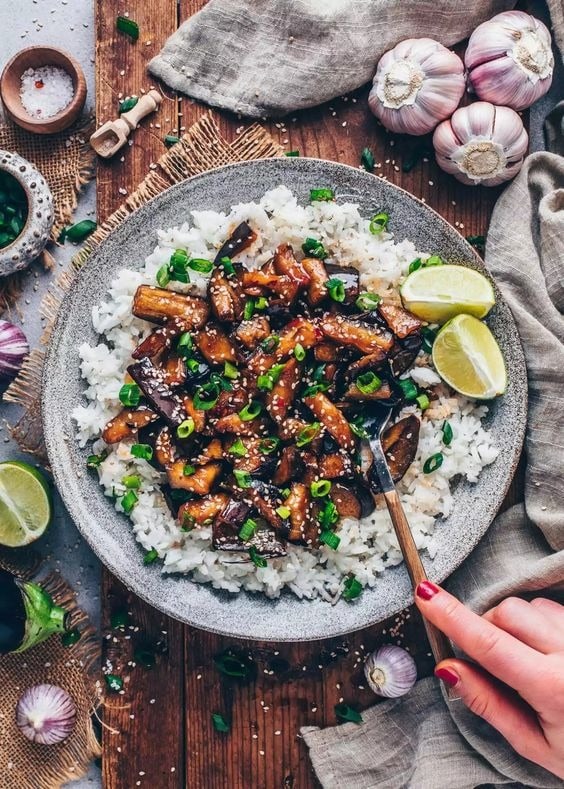 Chinese eggplants with chili garlic sauce served on top of white rice. 