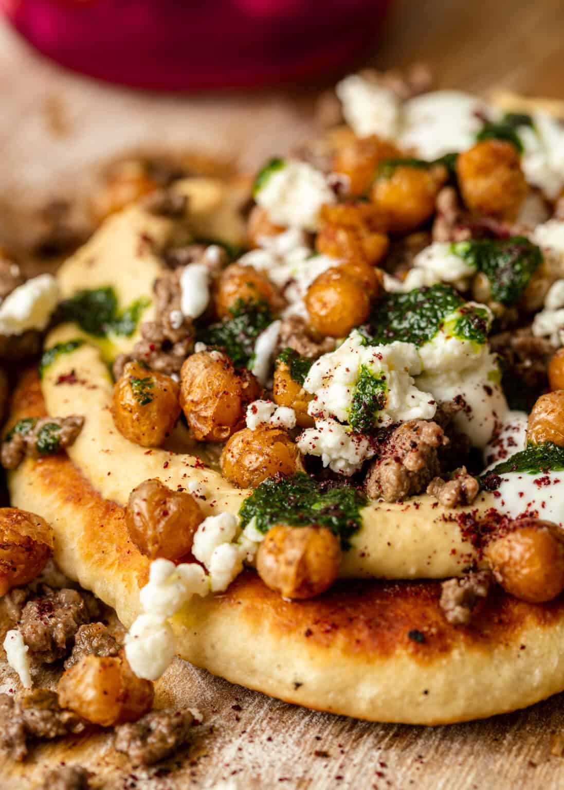 Mediterranean Flatbread Pizza with Hummus, Seasoned Ground Beef, Pesto, Feta, and Crunchy Roasted Chickpeas