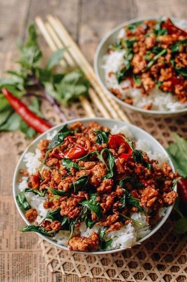 Rice in bowls topped with sautéed chicken 