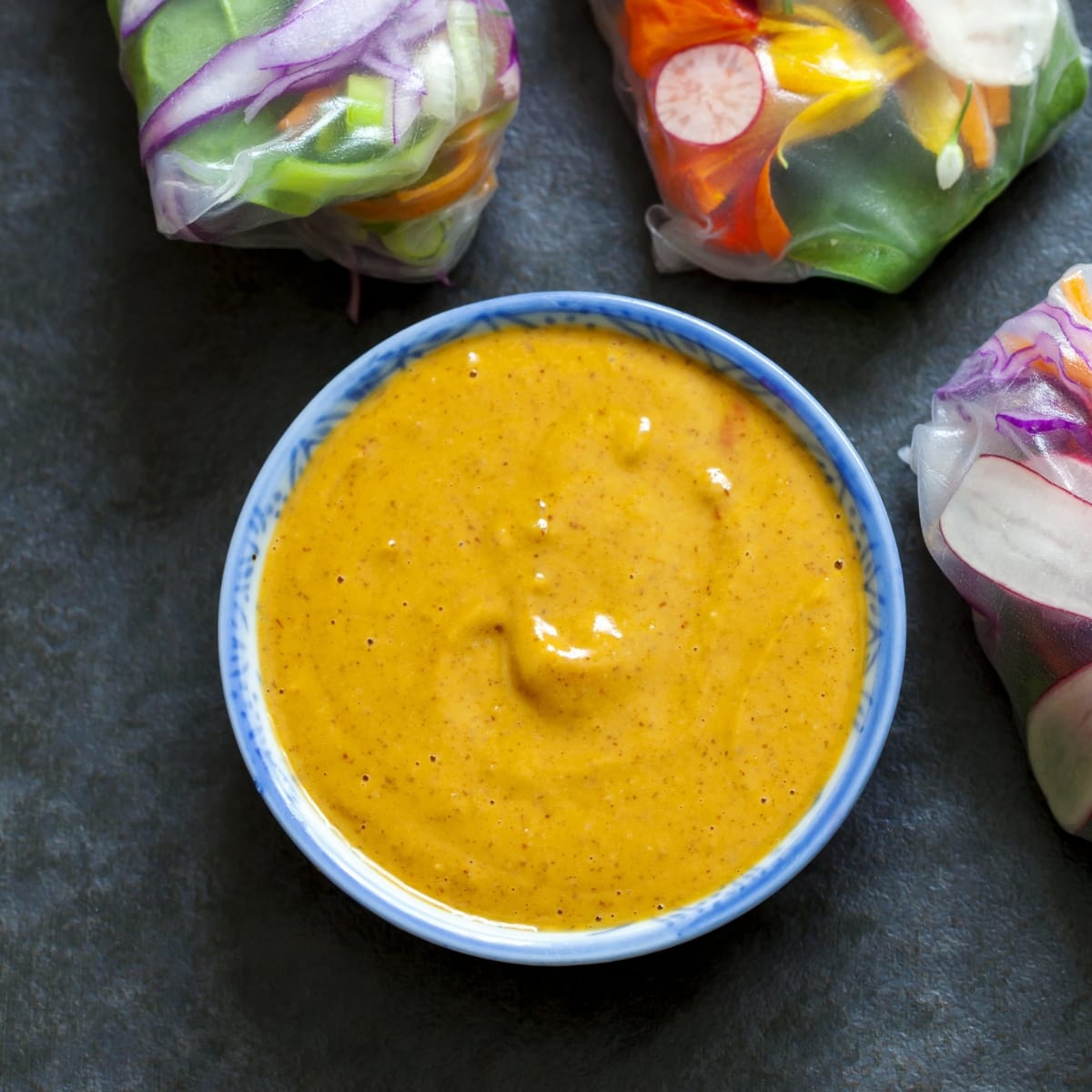 Homemade peanut sauce served with asian spring rolls