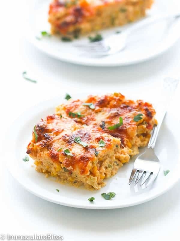 A slice of corn pie on a white plate.