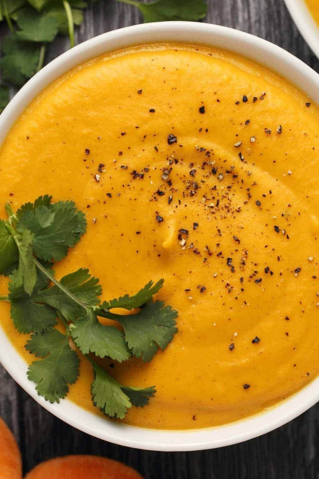 Potato soup in a bowl with sprinkle of black pepper on top. 