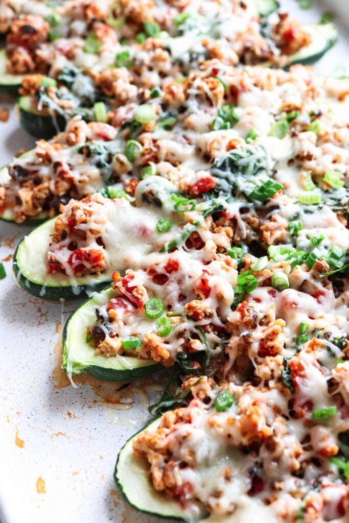 Sliced zucchini stuffed with ground chicken, onions, mushrooms, spinach, and tomatoes.
