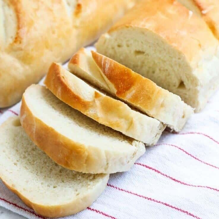 Sliced French bread on top of a cloth.