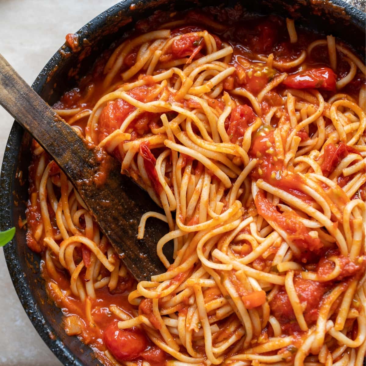 Spaghetti tossed on a pot. 