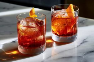 Two Mezcal Negroni in Rocks Glasses