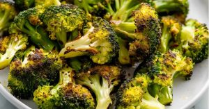 Air fried broccoli in a white plate.