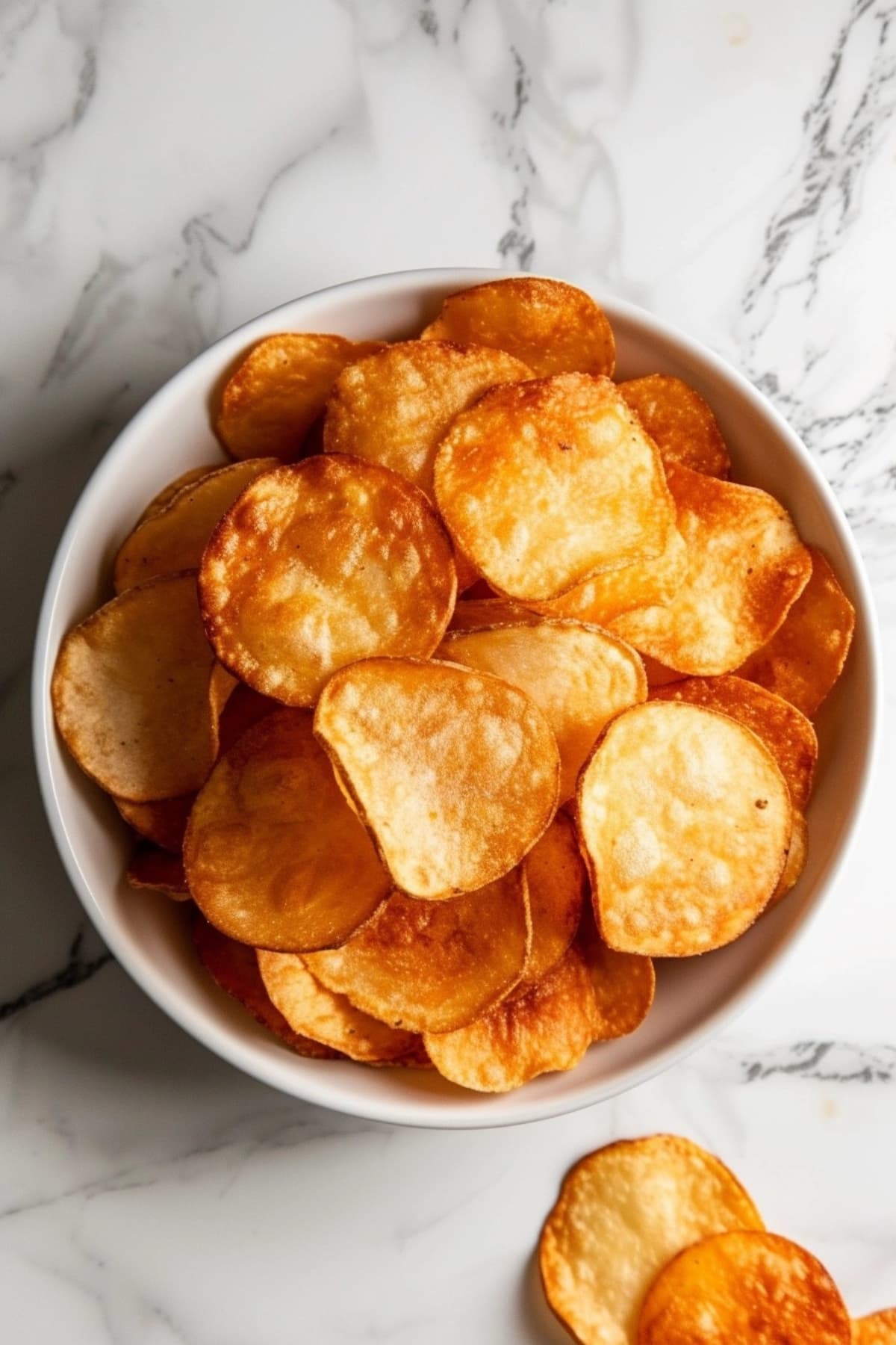 Bunch of air fryer potato chips in bowl