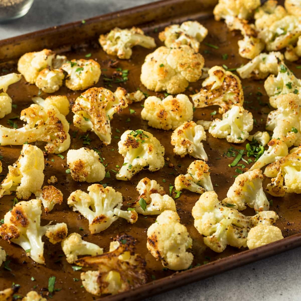 Roasted broccoli in a sheet pan.