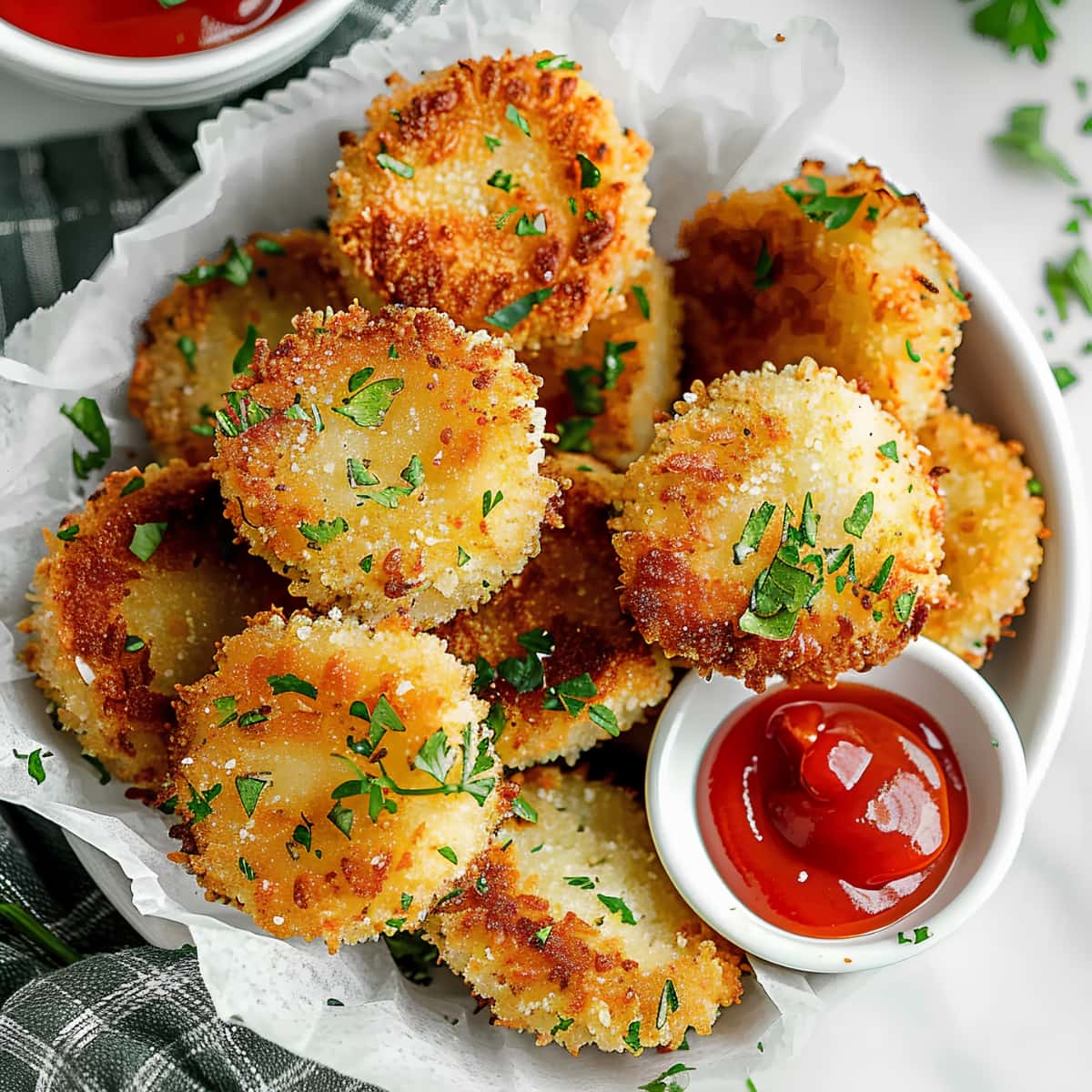 Deep fried air fryer zucchini in a bowl, served with ketchup