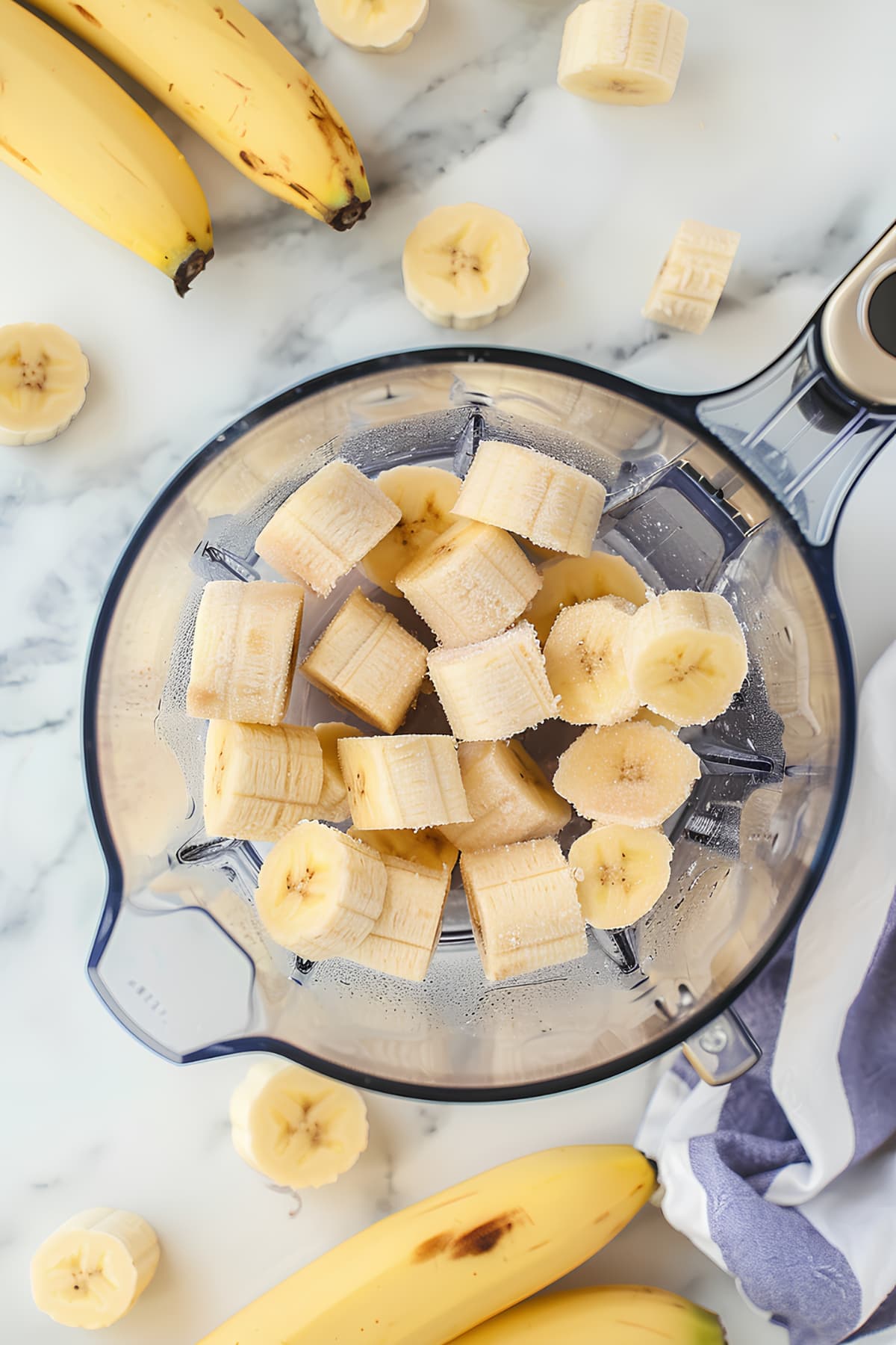 Frozen bananas in a food processor, top view