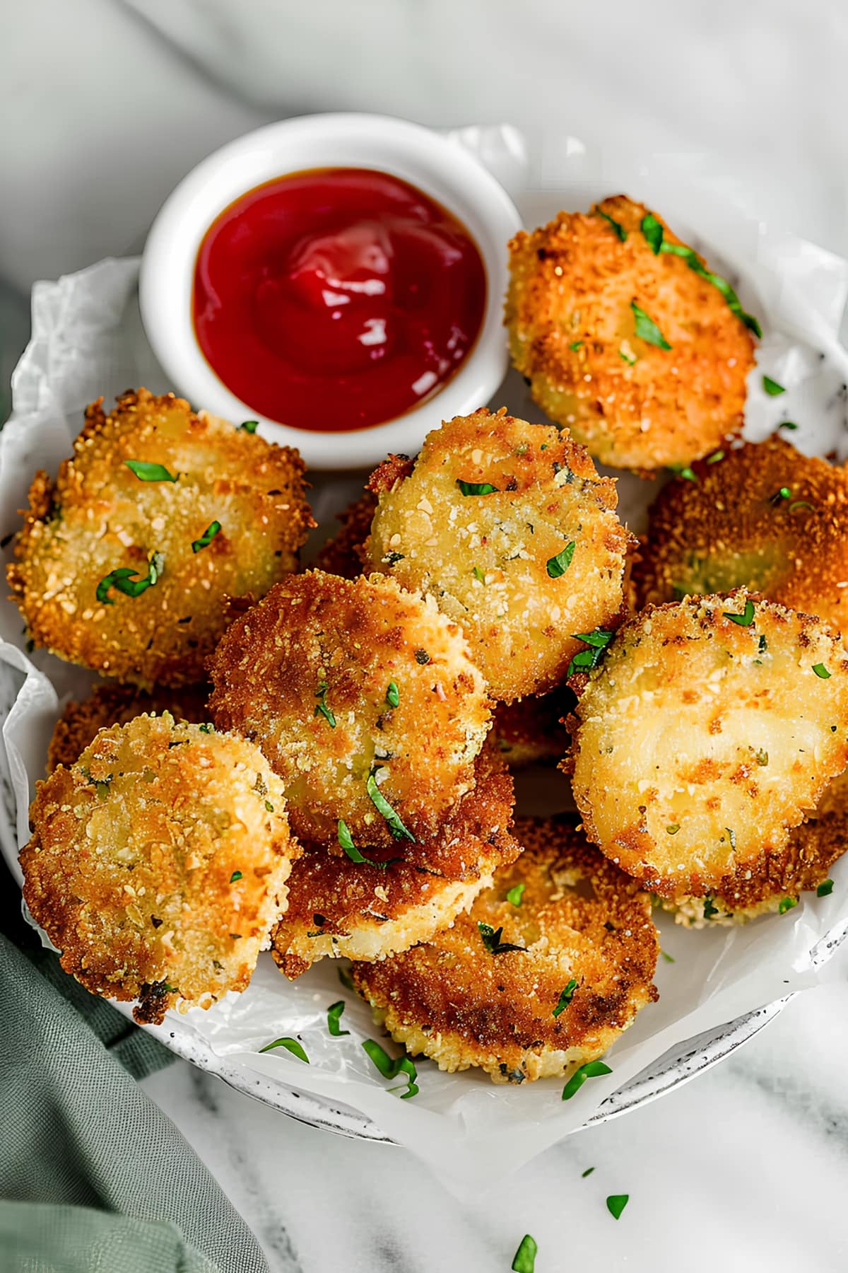 Homemade air fryer zucchini chips with ketchup on the side