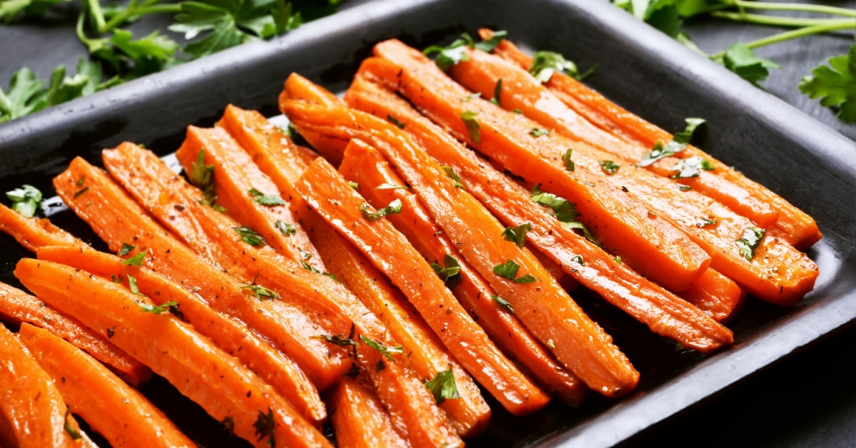 Honey roasted carrots on a baking pan.