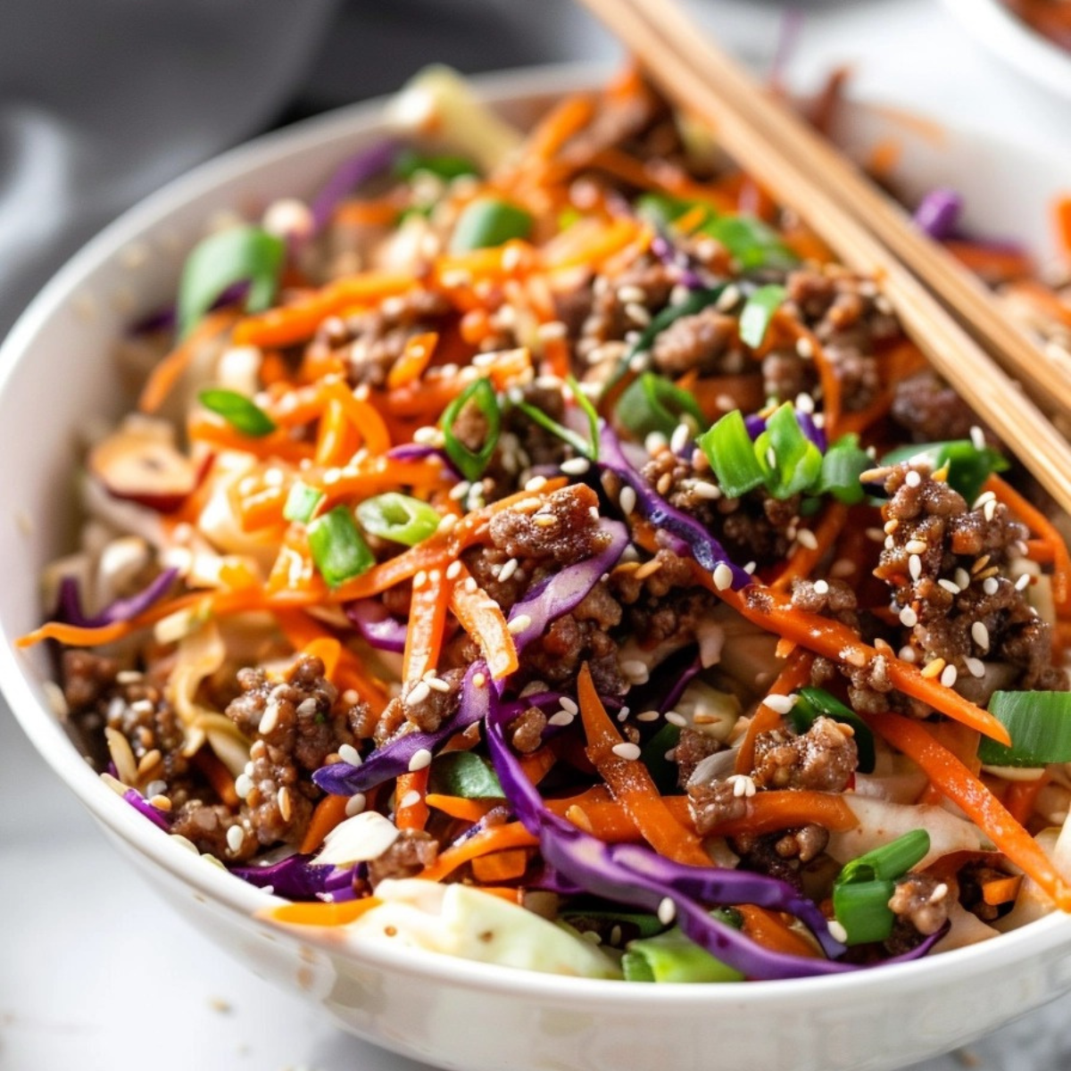 Closeup of crack slaw in a white bowl.