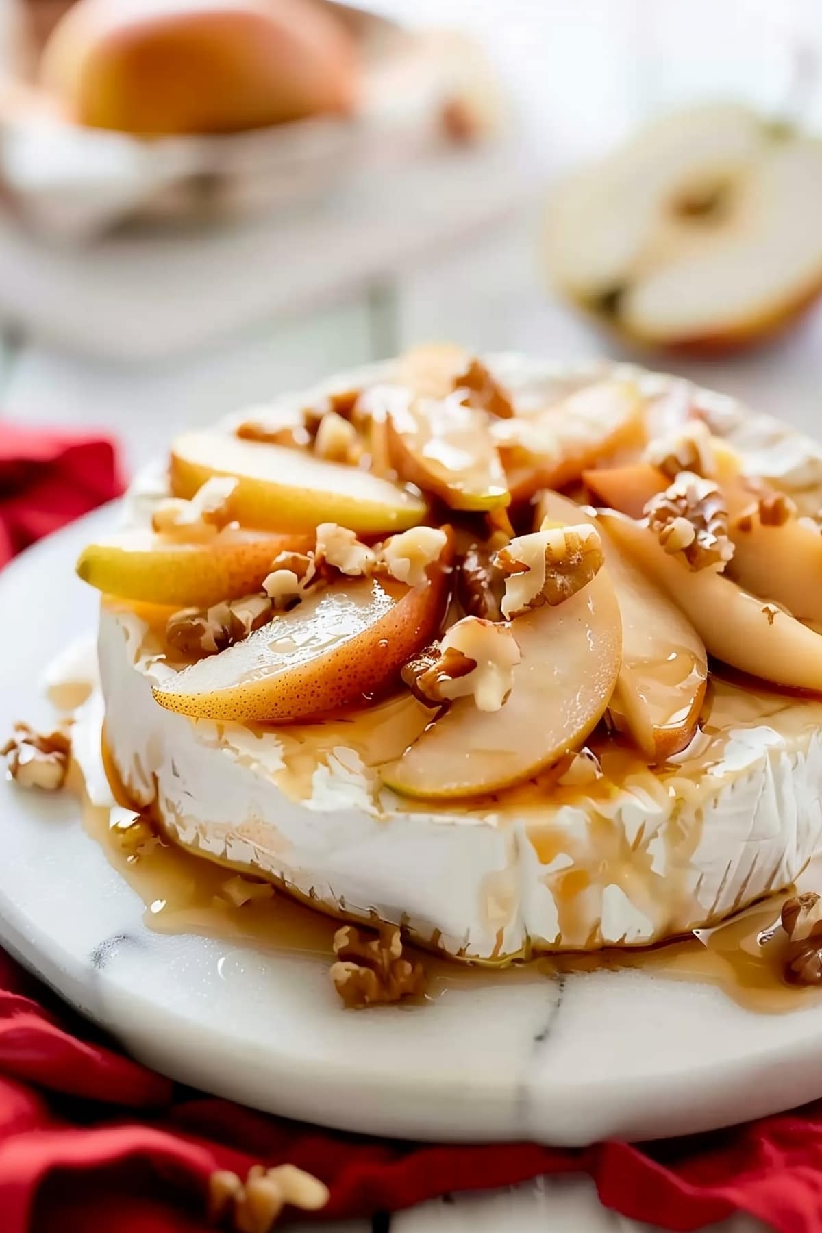 Homemade baked brie with caramelized pecans and chopped walnuts