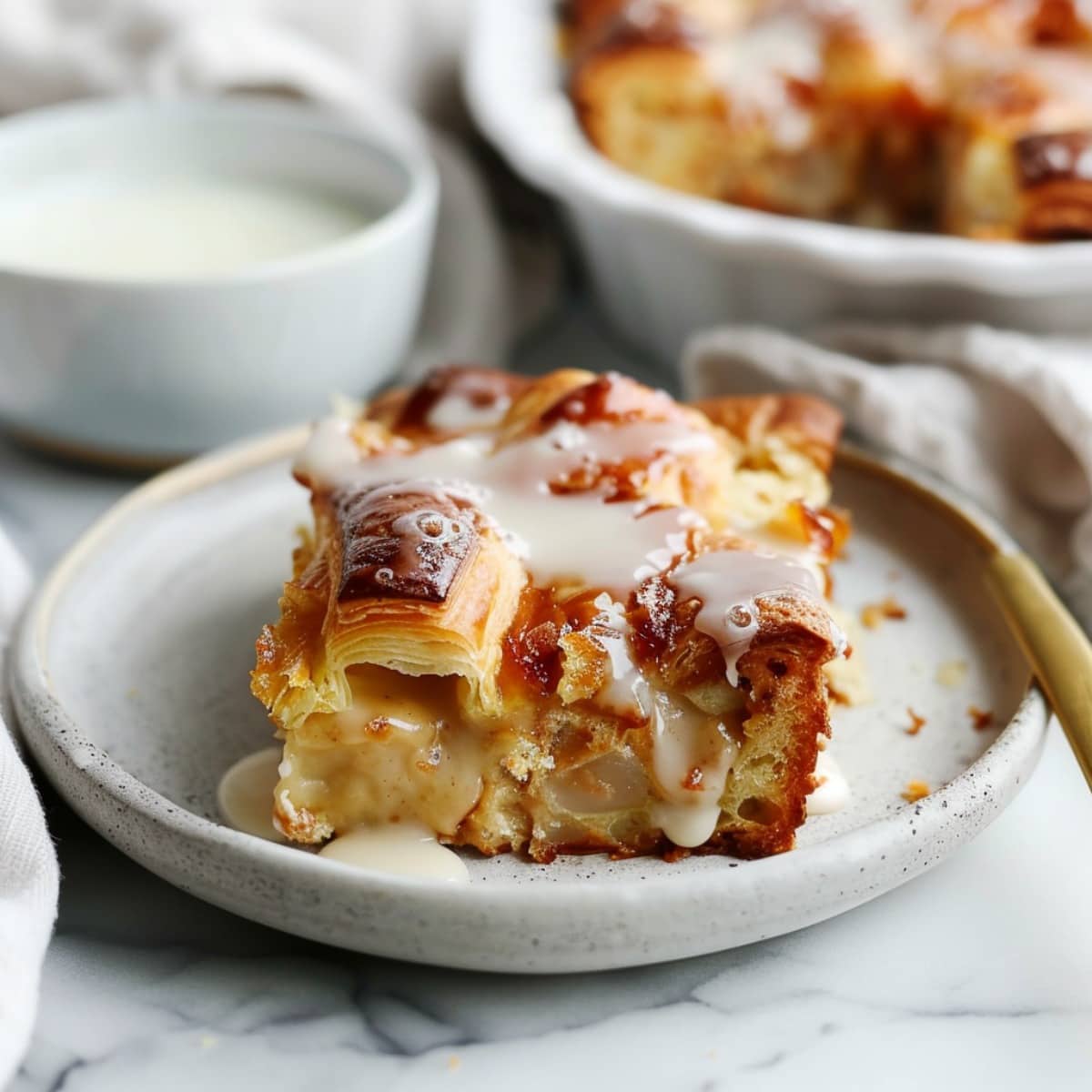 Slice of Croissant Bread Pudding on a plate