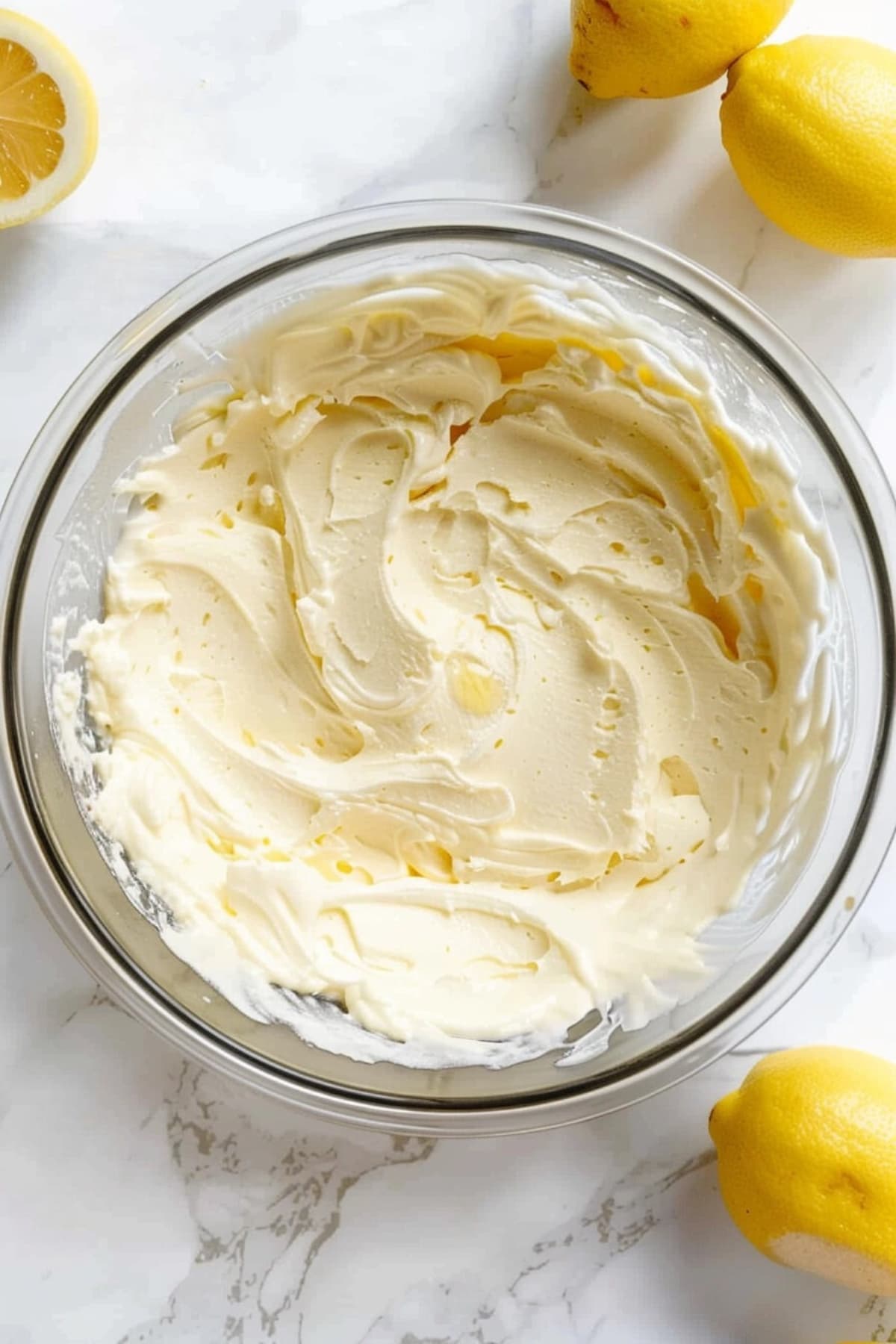 Lemonade cheesecake filling in a glass bowl.