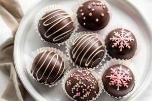 Homemade decorated hot chocolate bombs filled with cocoa mix powder and mini-marshmallows