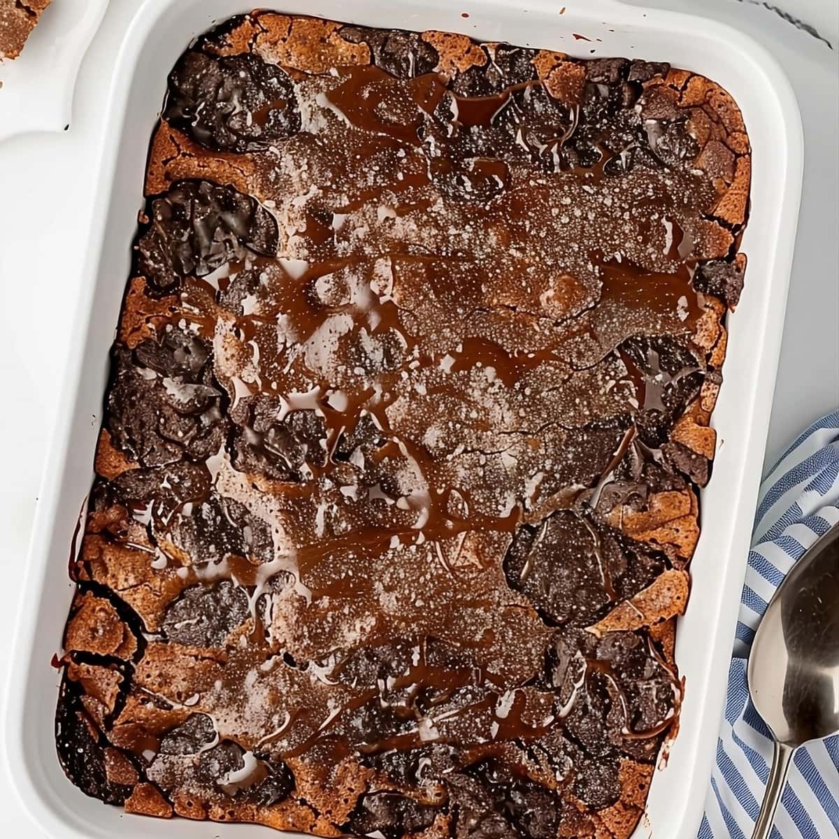 Top view of an Oreo dump cake in a white baking dish.