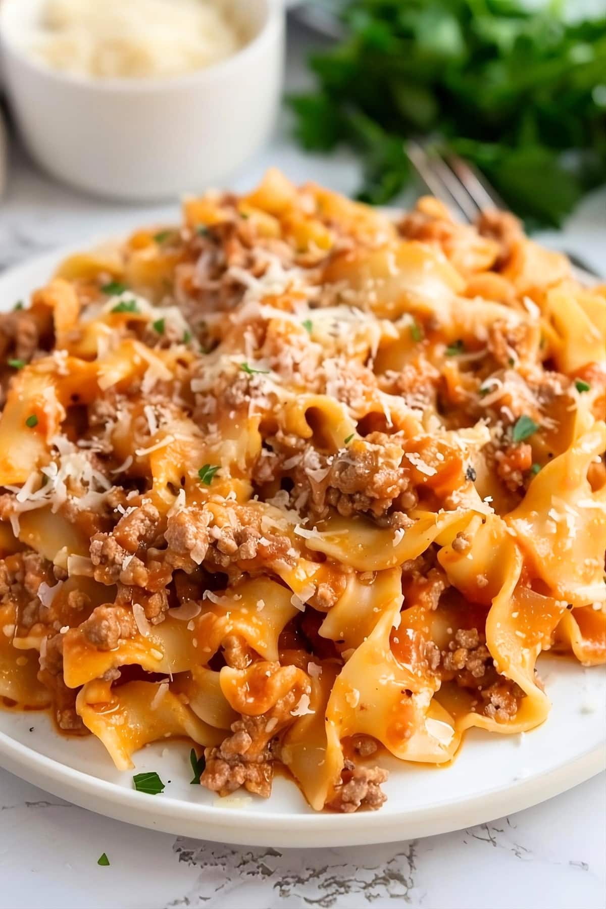 Plateful of Amish country casserole sprinkled with grated parmesan cheese.