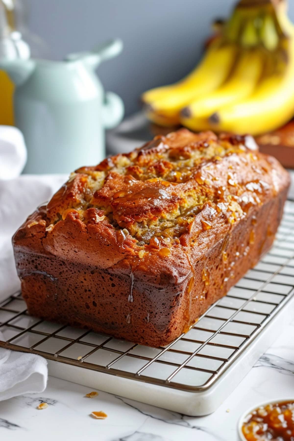 Banana bread on a cooling rack.