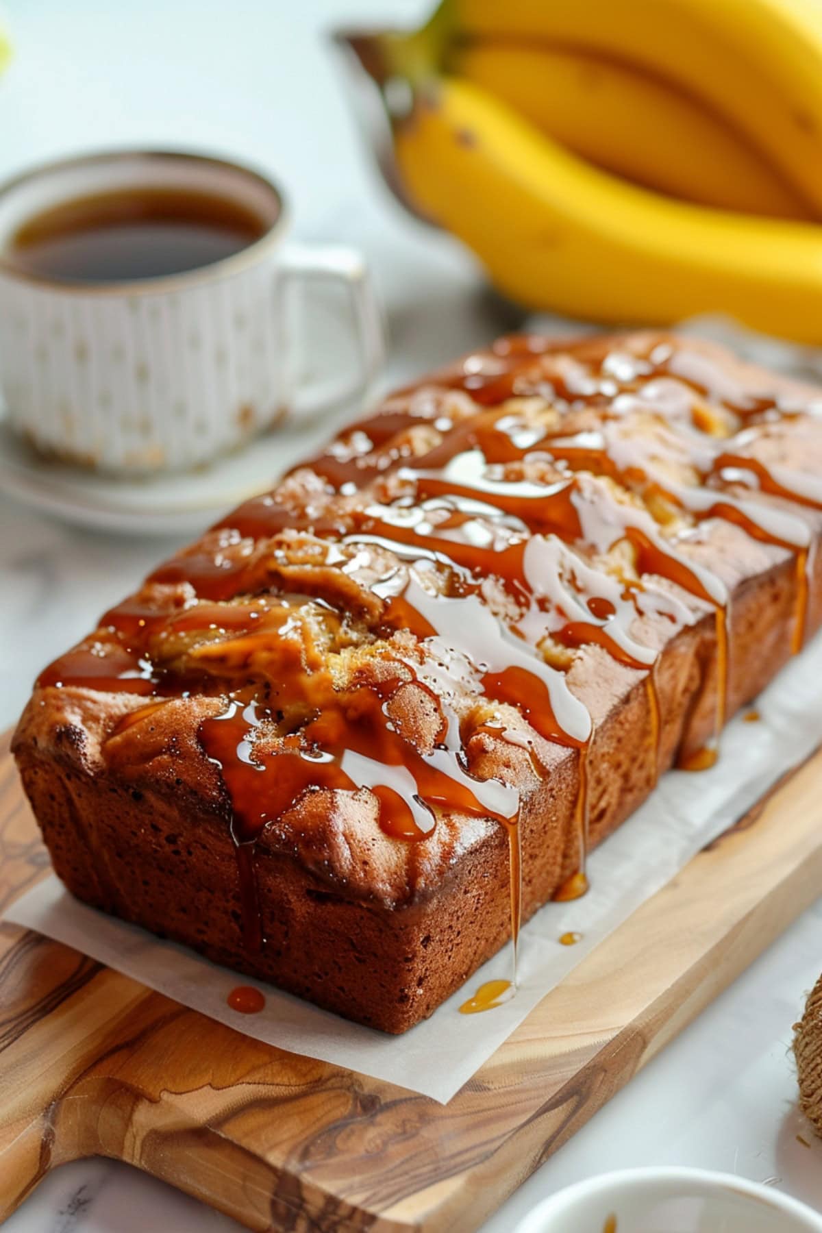 Whole Salted Caramel Banana Bread
on a wooden board drizzled with caramel.
