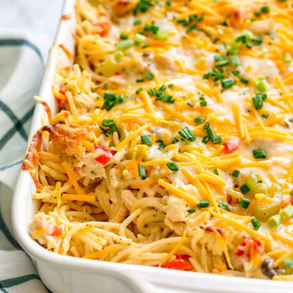 Cheesy chicken spaghetti casserole in baking dish