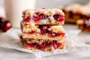 Sweet cherry pie bars, bursting with juicy cherries and a buttery crust, perfect for dessert lovers