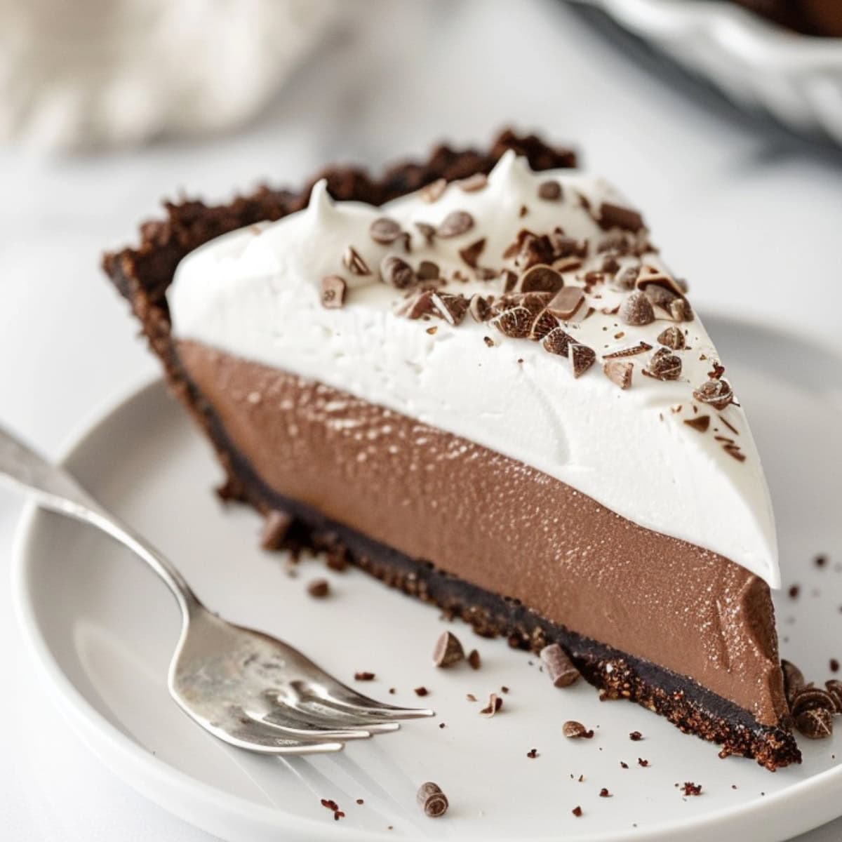 Creamy slice of chocolate pie with oreo crust