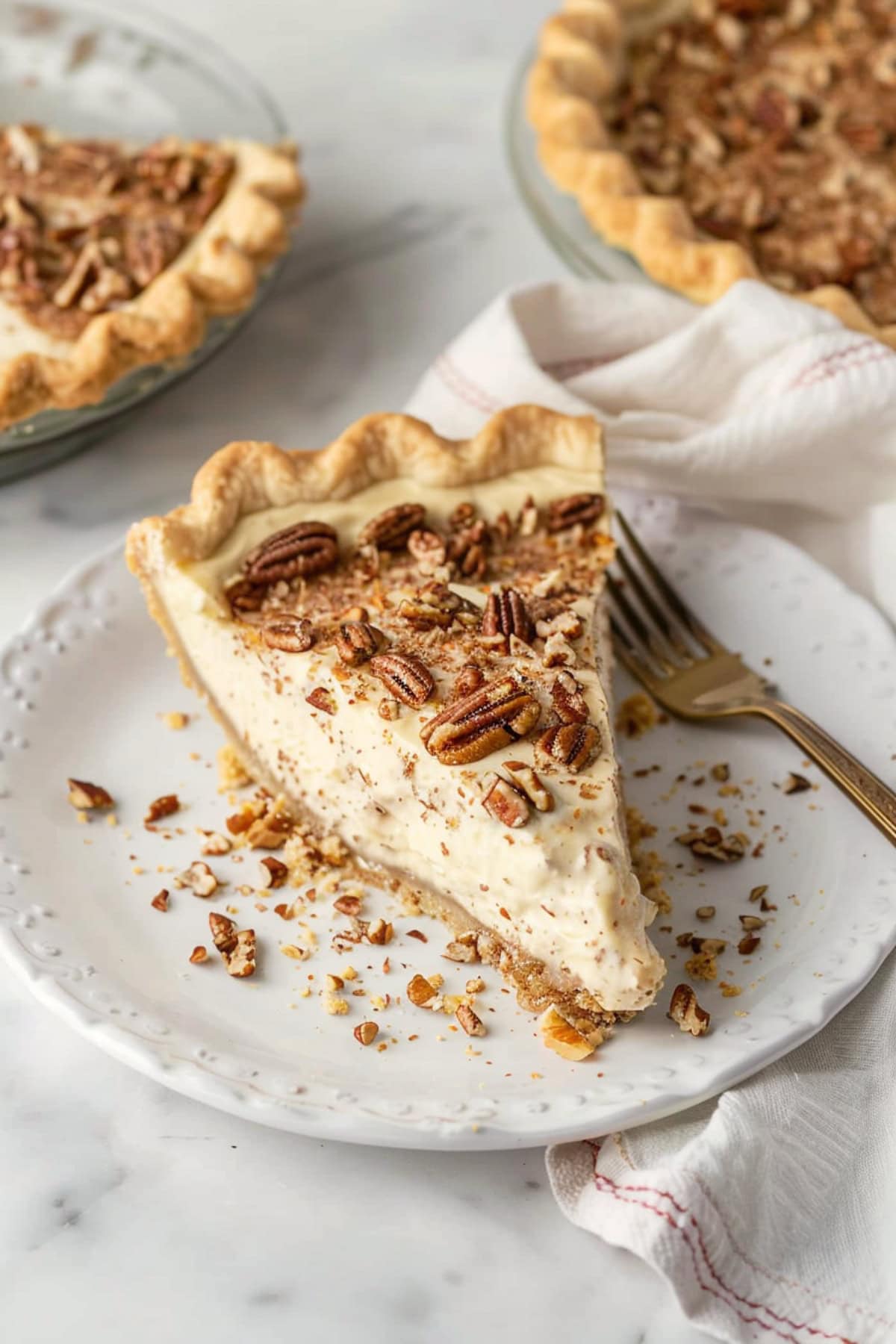 Slice of no-bake pecan cream pie in a flaky and buttery pie crust