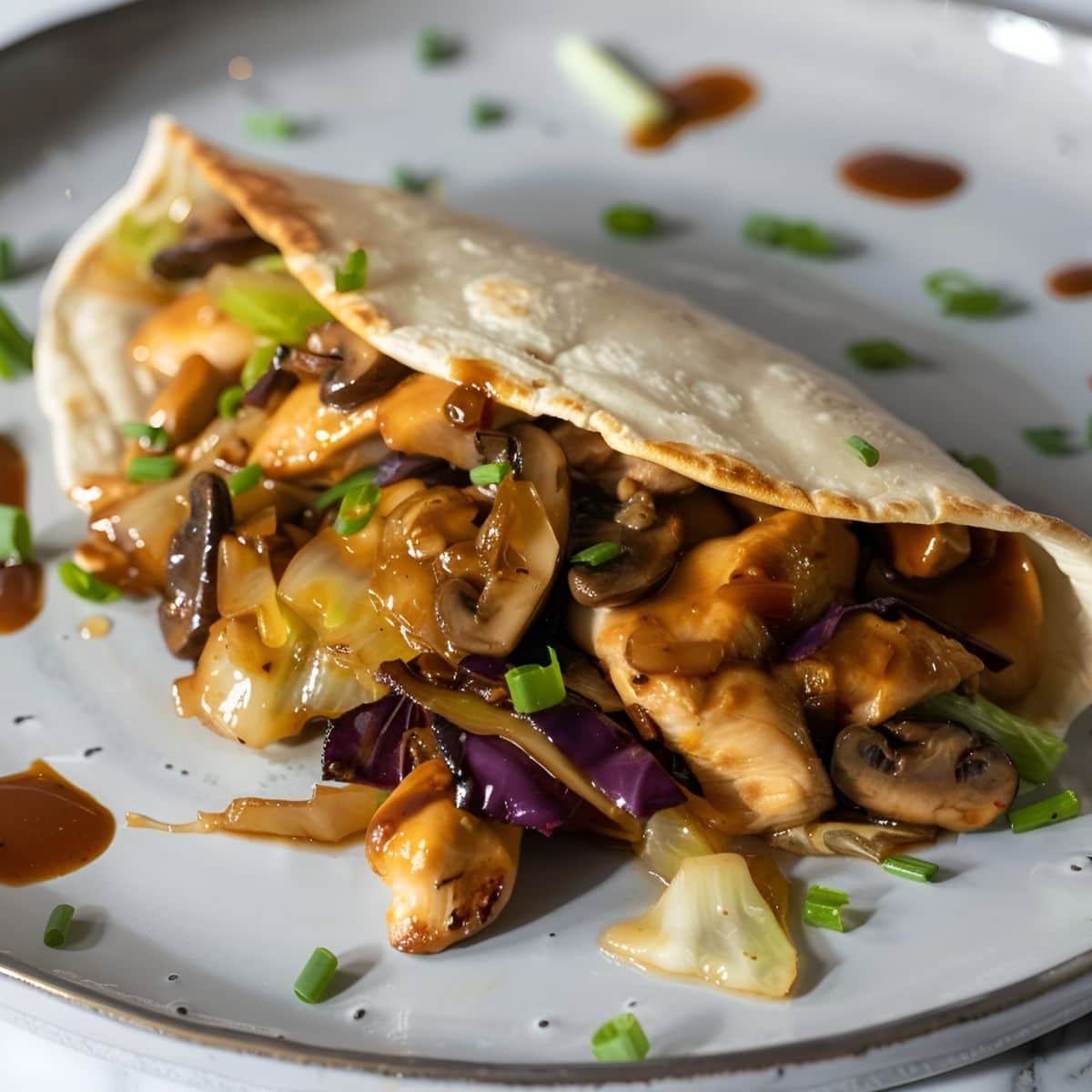 Moo Shu Chicken Served in Mandarin Pancake on a Gray Plate