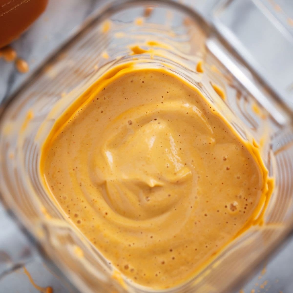 Close Up Top View of Creamy Pumpkin Milkshake in a Blender