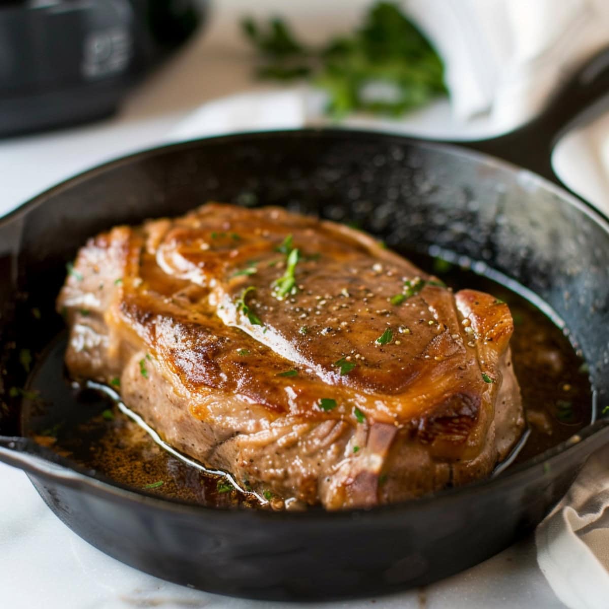 Pork roast seared in a cast iron.