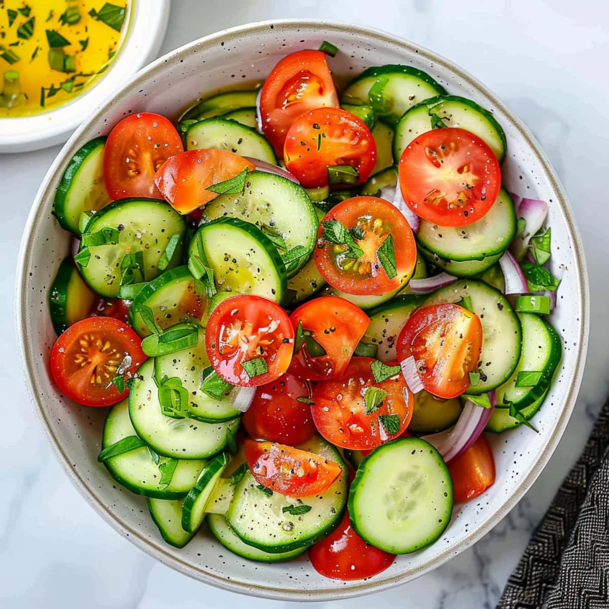 Tomato and cucumber salad combined with red onions and parsley.