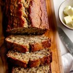 Top View of Bisquick Banana Bread Loaf, Sliced on a Wood Cutting Board