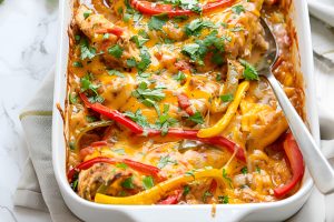 Chicken fajita casserole in a 9x13 inch baking dish.