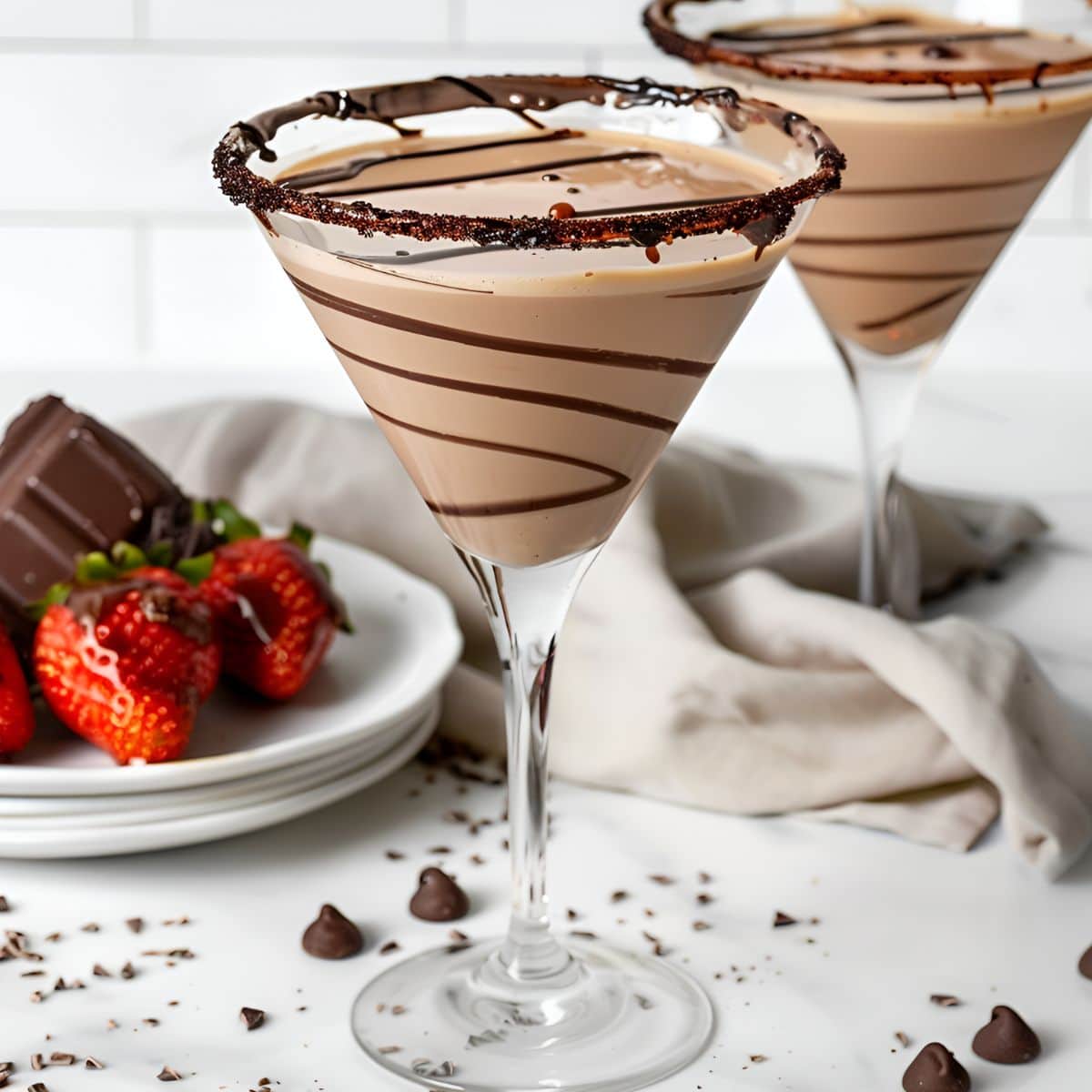 Two Godiva Chocolate Martinis with Chocolate Drizzles, Chocolate Rim, and a Plate of Chocolate and Chocolate-Covered Strawberries